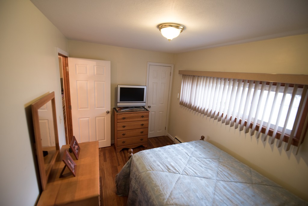 362 Stapleton Road Springfield, MA 01109 - Photo 11 of 24 a bedroom with furniture and a flat screen tv