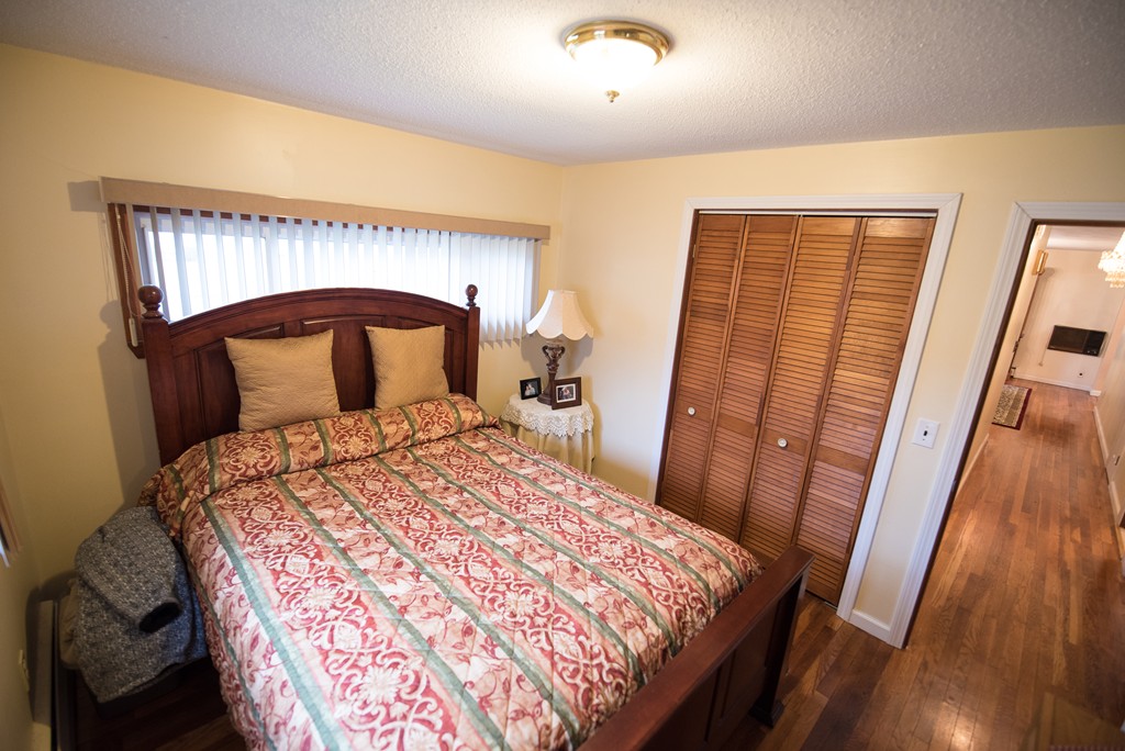 362 Stapleton Road Springfield, MA 01109 - Photo 12 of 24 a bedroom with a bed and a mirror