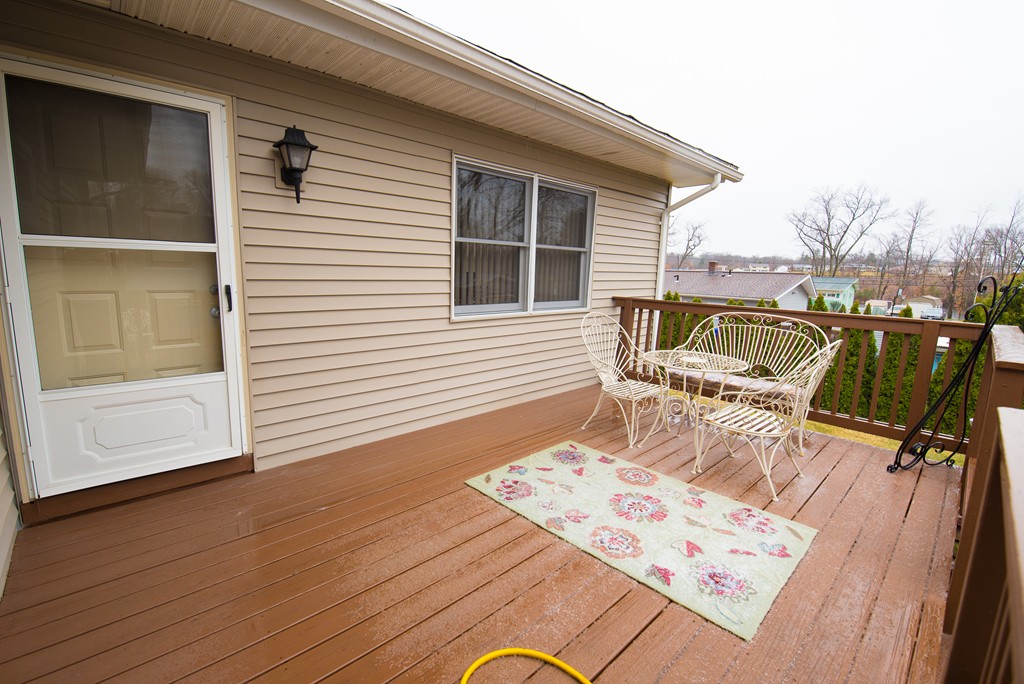 362 Stapleton Road Springfield, MA 01109 - Photo 20 of 24 a view of a deck with a table and chairs and wooden floor