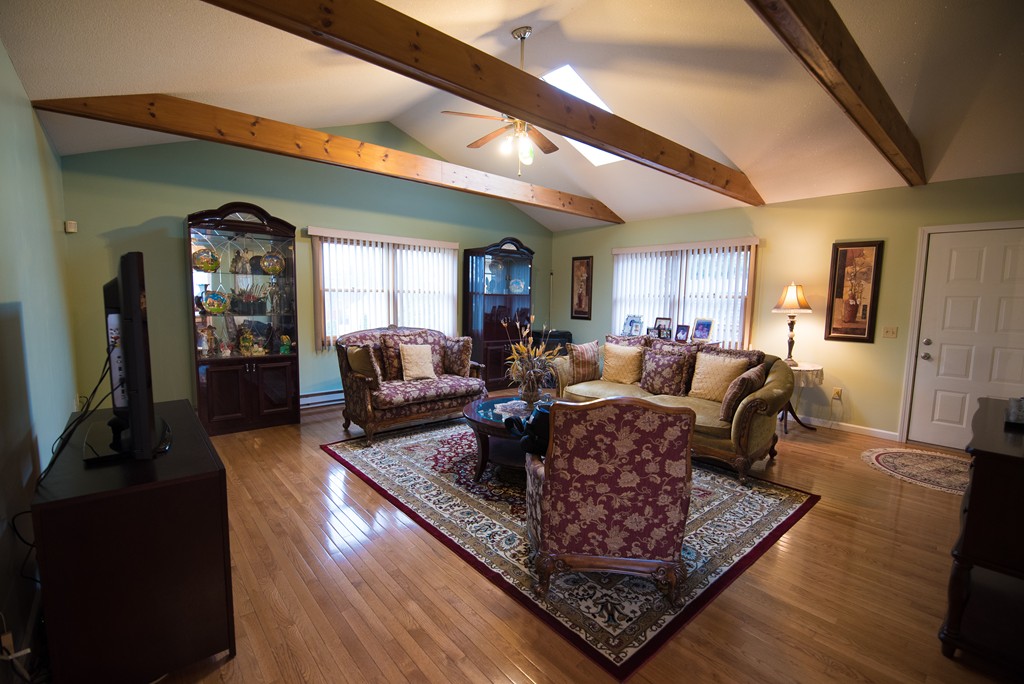362 Stapleton Road Springfield, MA 01109 - Photo 3 of 24 a living room with furniture and a wooden floor
