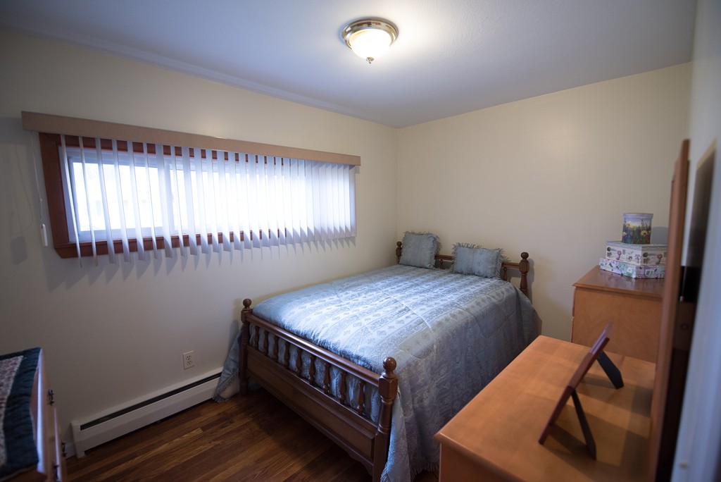 362 Stapleton Road Springfield, MA 01109 - Photo 10 of 24 a bedroom with a bed and a window