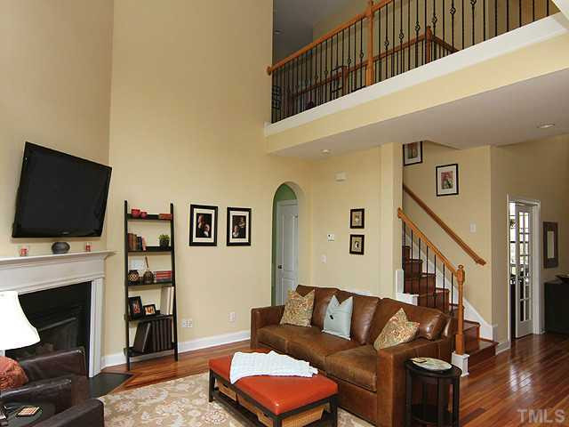 10016 Darling Street Raleigh, NC 27613 - Photo 3 of 13 Family room with Eucalyptus hardwoods, gas log FP, wrought iron railings. Open to kitchen. Other