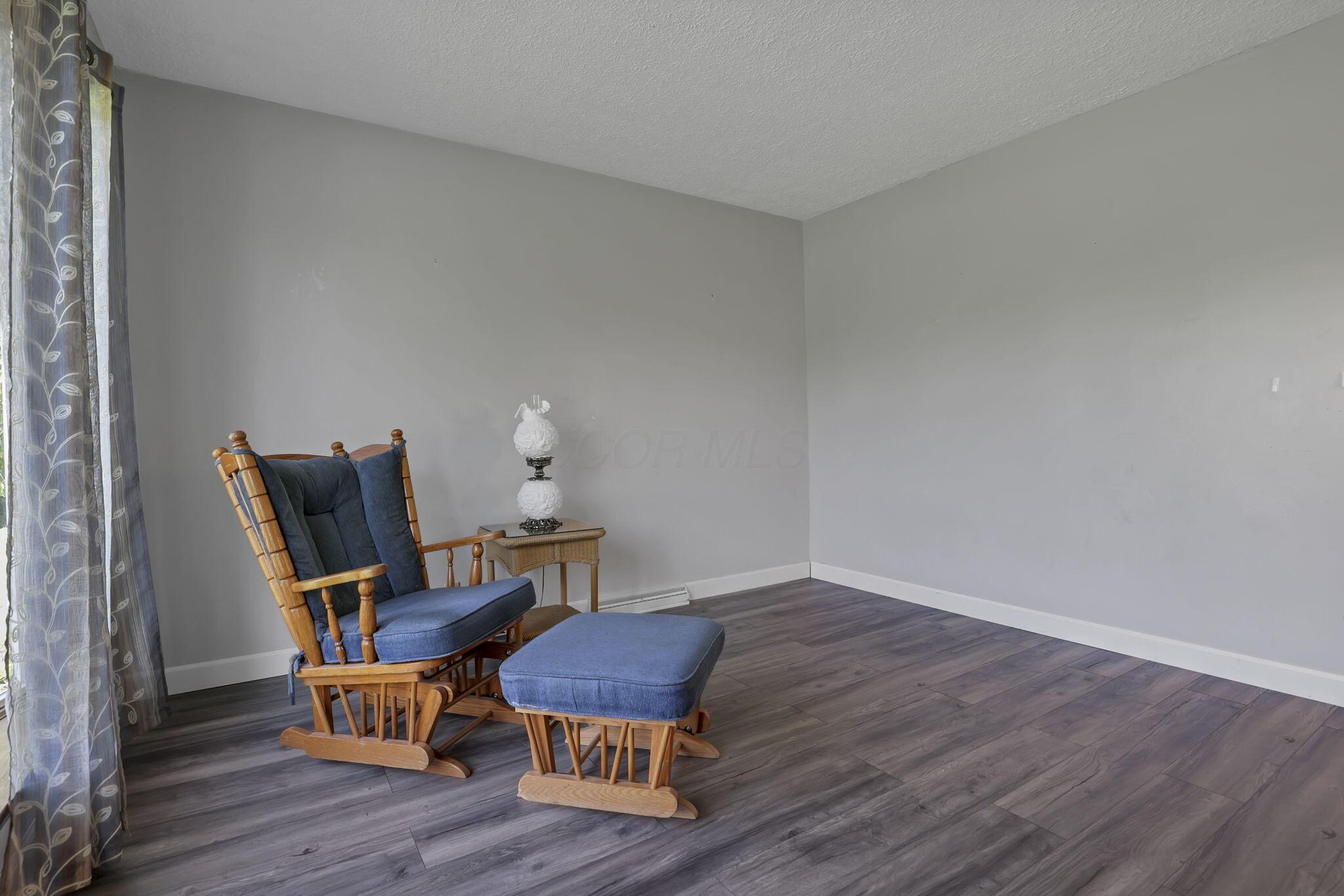 6605 Lancaster Road Hebron, OH 43025 - Photo 21 of 53 This first-floor room, featuring a pocket door and new flooring, is the perfect flex space for an office, playroom, or guest room.