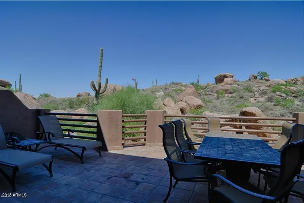 a view of a chairs and table in the terrace