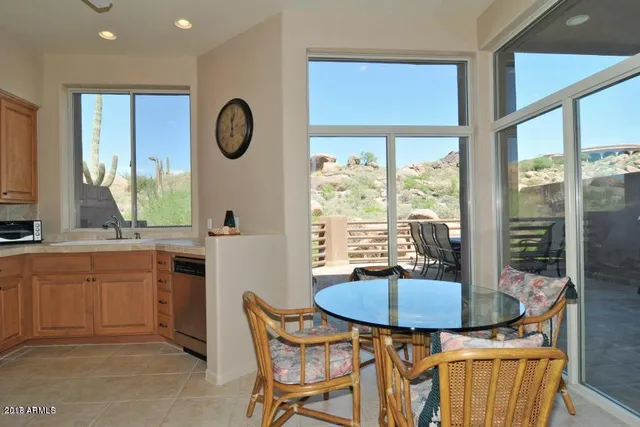 a kitchen with a sink cabinets and window