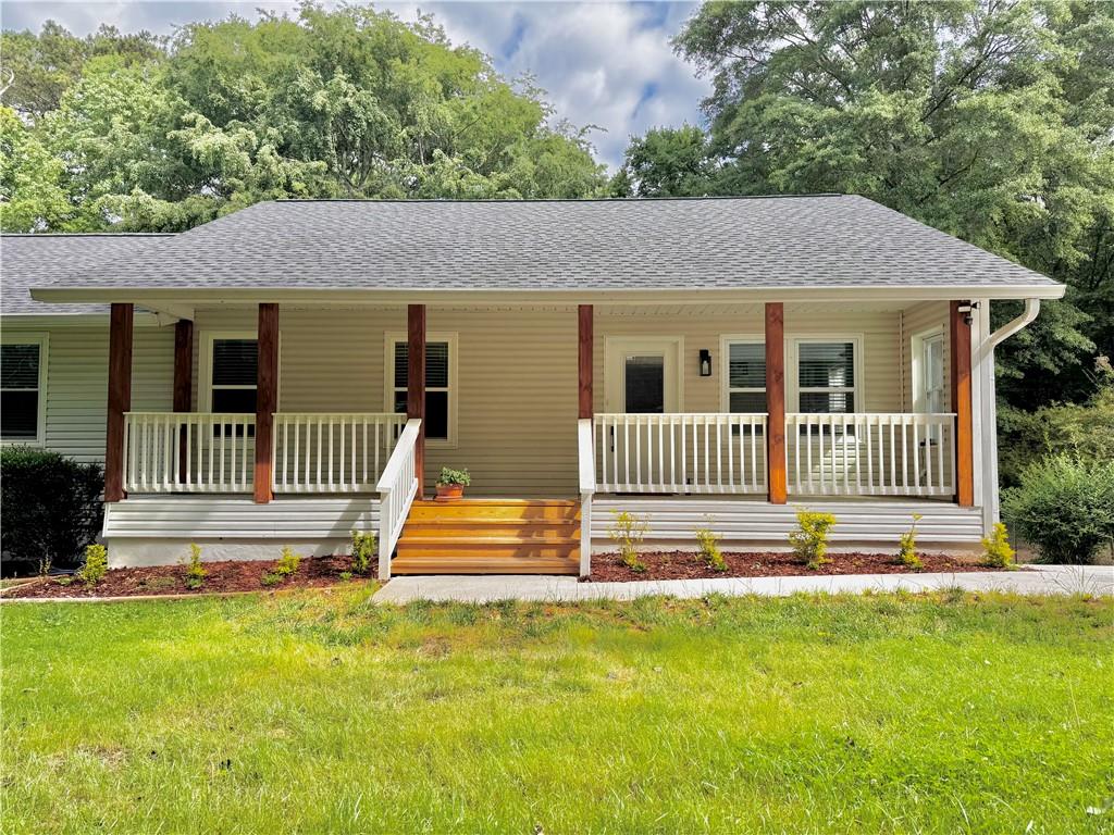 641 Virginia Avenue Suwanee, GA 30024 - Photo 1 of 1 a front view of a house with a yard
