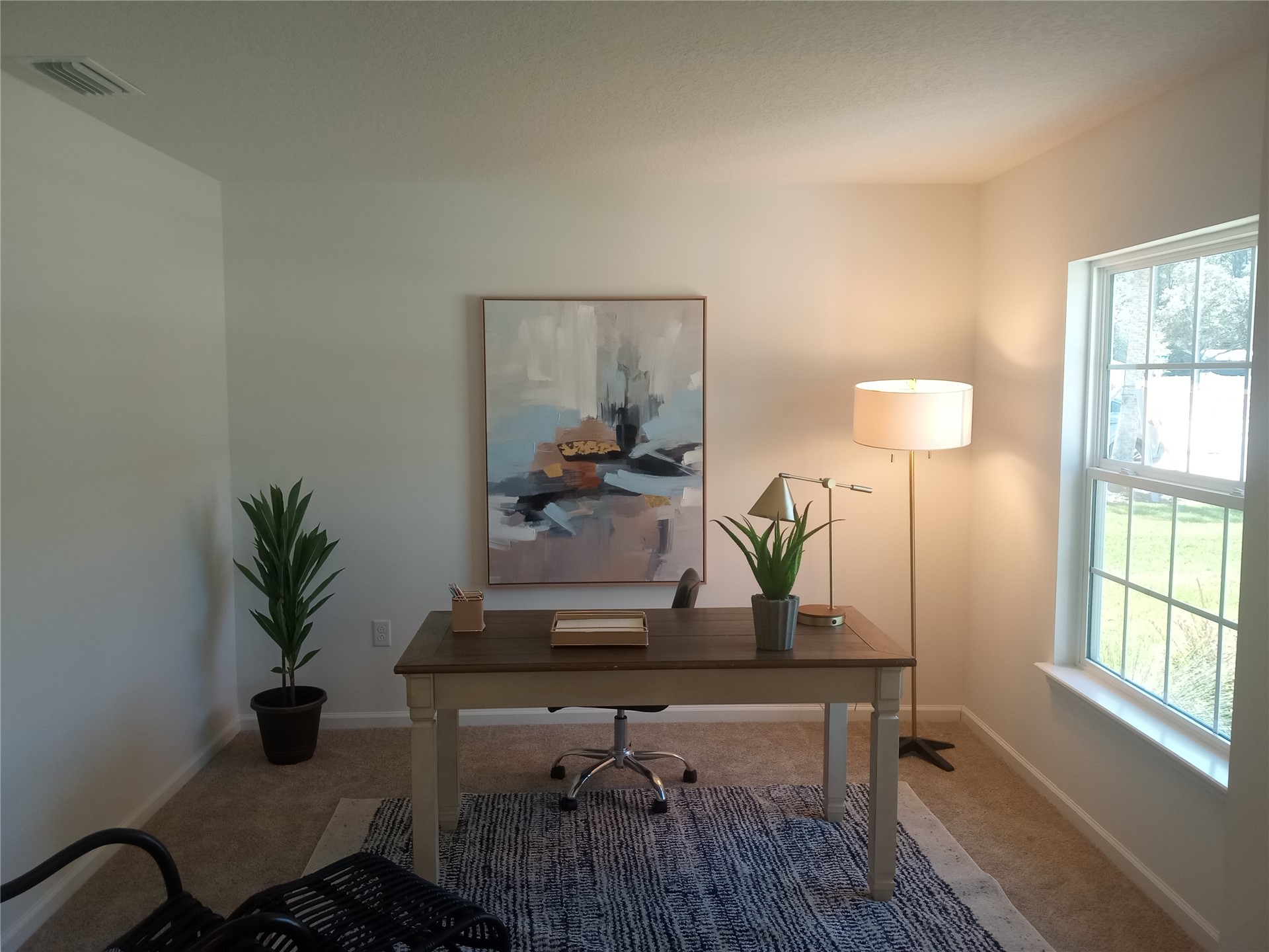 96052 Pirates Bluff Road Yulee, FL 32097 - Photo 15 of 22 a living room with furniture and a potted plant