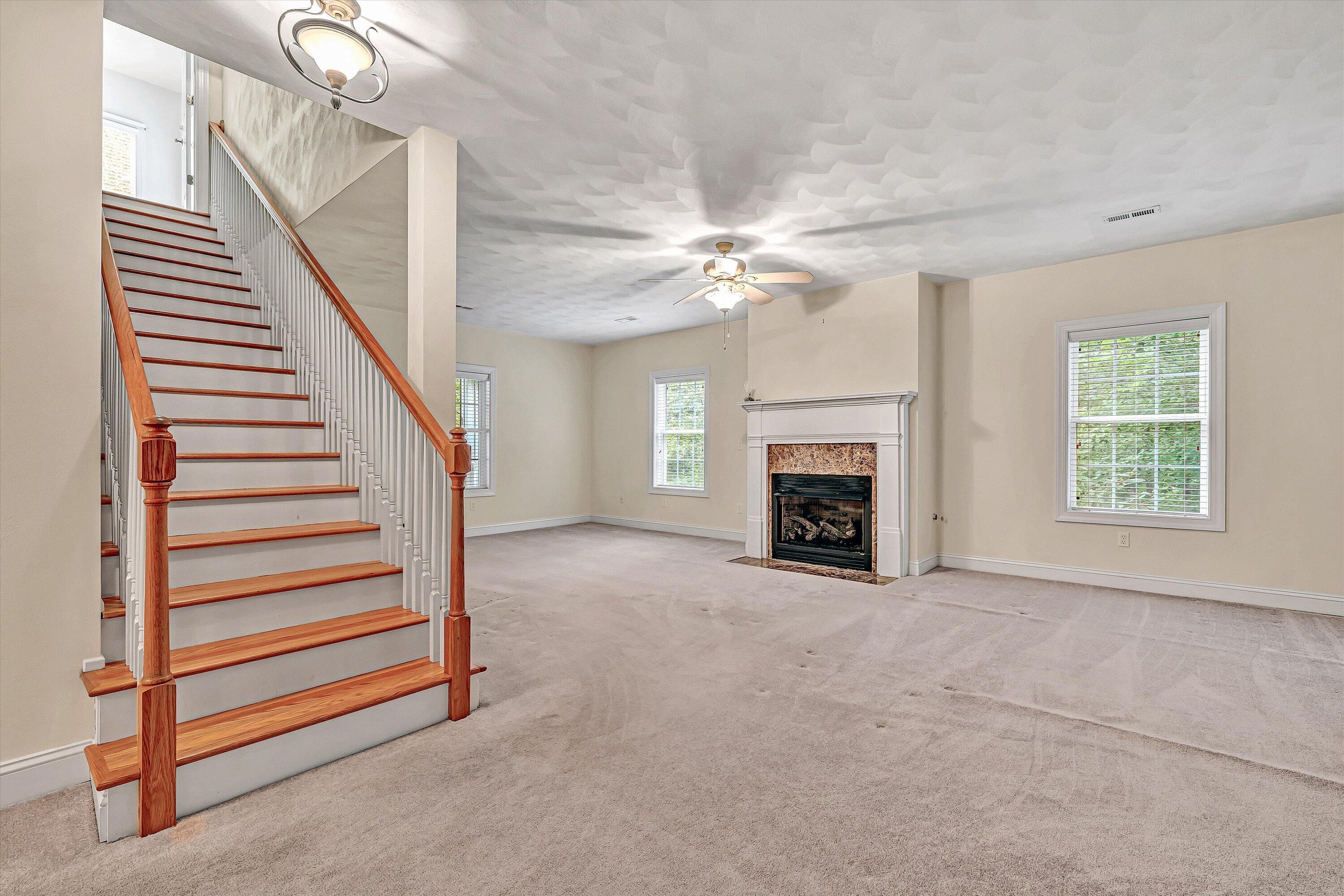 131 Stoney Mill Road Rocky Mount, VA 24151 - Photo 23 of 37 an empty room with windows and fireplace