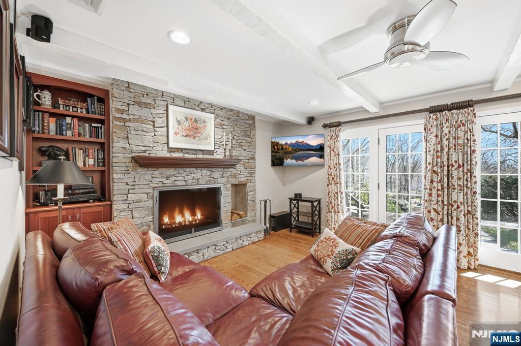760 Rivenwood Road Franklin Lakes, NJ 07417 - Photo 14 of 48 a living room with furniture a fireplace and a large window