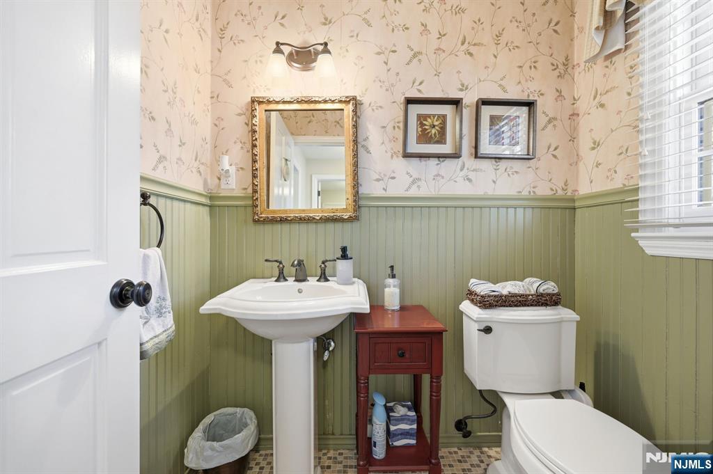 760 Rivenwood Road Franklin Lakes, NJ 07417 - Photo 15 of 48 a bathroom with a toilet sink and mirror