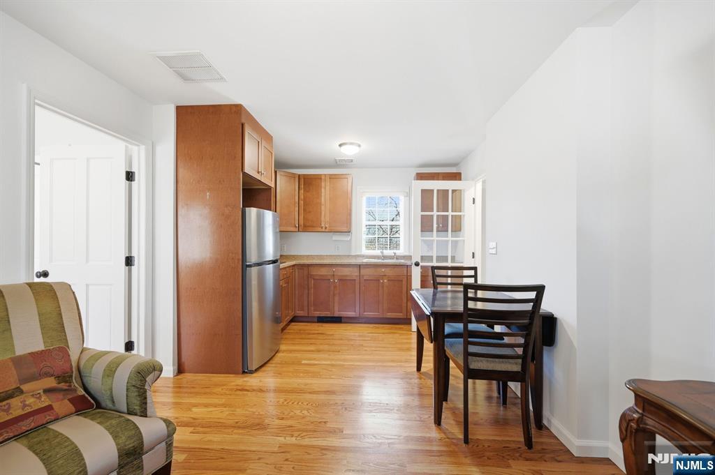 760 Rivenwood Road Franklin Lakes, NJ 07417 - Photo 18 of 48 a living room with stainless steel appliances furniture a refrigerator and a kitchen view