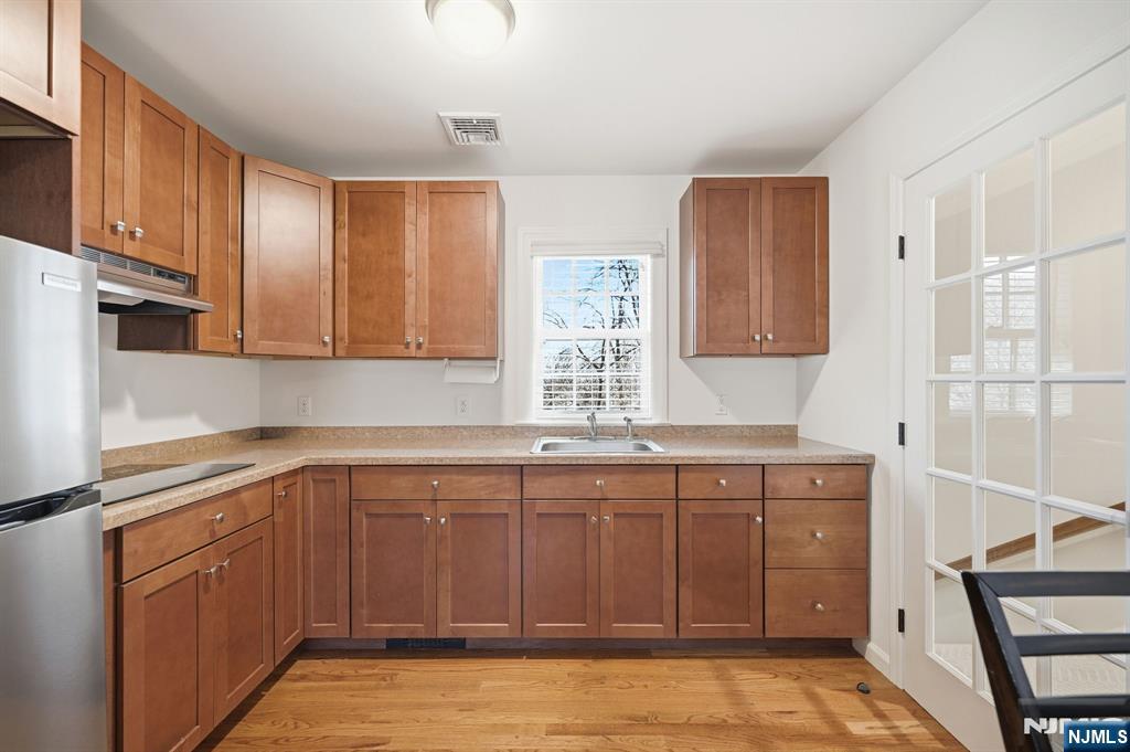 760 Rivenwood Road Franklin Lakes, NJ 07417 - Photo 19 of 48 a kitchen with stainless steel appliances granite countertop a sink and cabinets