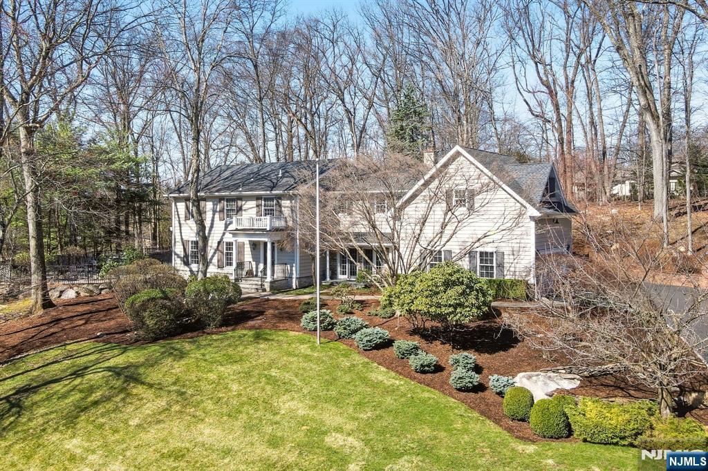 760 Rivenwood Road Franklin Lakes, NJ 07417 - Photo 2 of 48 a front view of house with yard and trees around