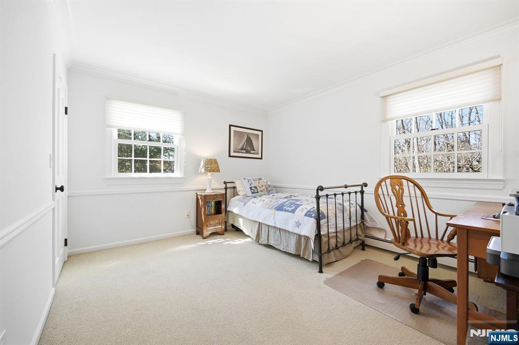 760 Rivenwood Road Franklin Lakes, NJ 07417 - Photo 25 of 48 a bed room with furniture and a window