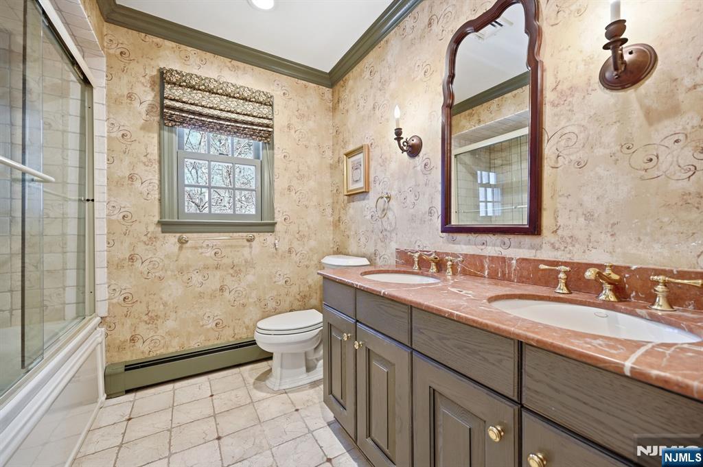760 Rivenwood Road Franklin Lakes, NJ 07417 - Photo 26 of 48 a bathroom with a sink a toilet and shower
