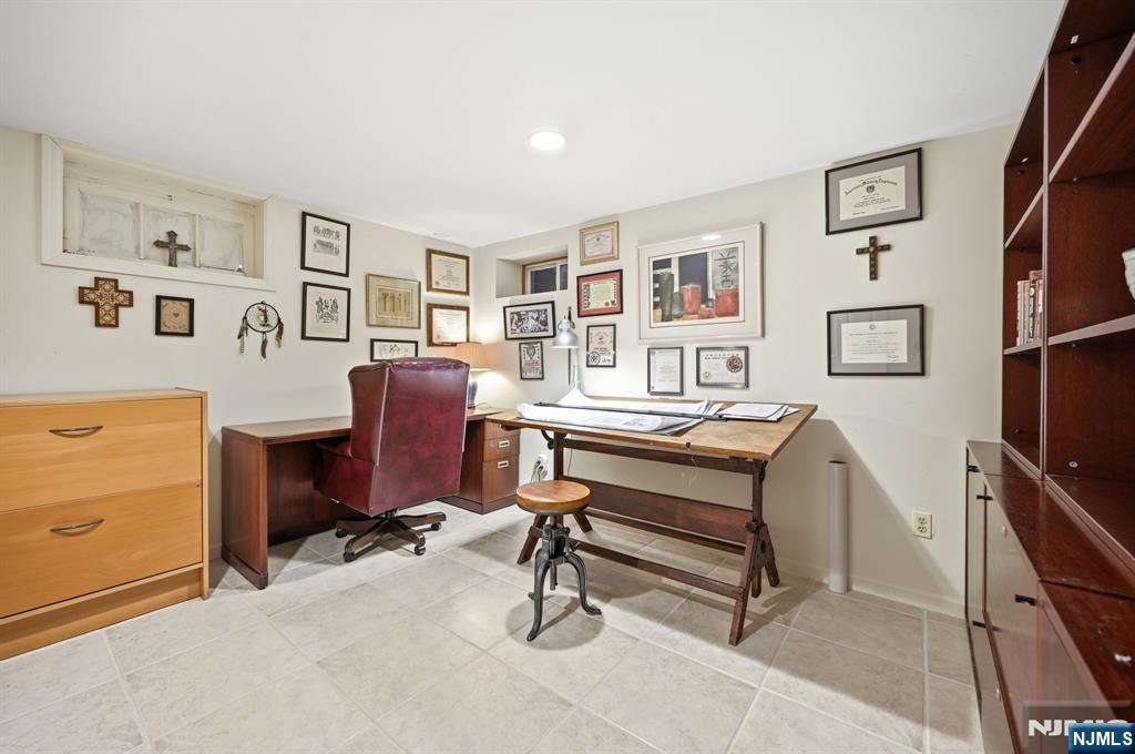 760 Rivenwood Road Franklin Lakes, NJ 07417 - Photo 29 of 48 a view of a livingroom with workspace and a window