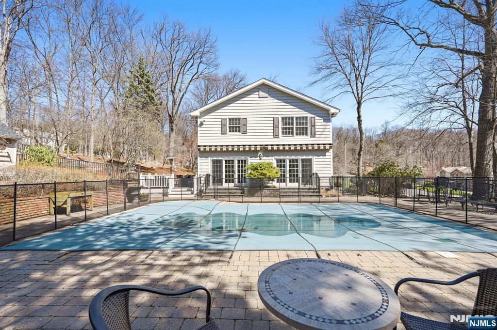 760 Rivenwood Road Franklin Lakes, NJ 07417 - Photo 31 of 48 a view of a house with backyard