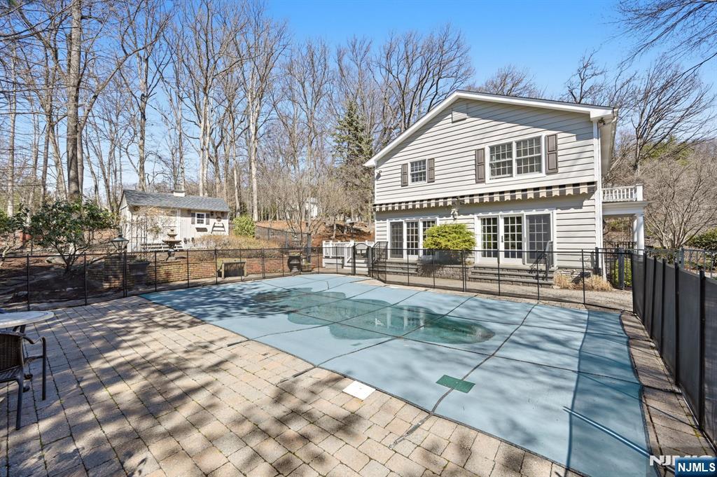 760 Rivenwood Road Franklin Lakes, NJ 07417 - Photo 32 of 48 a front view of a house with a yard