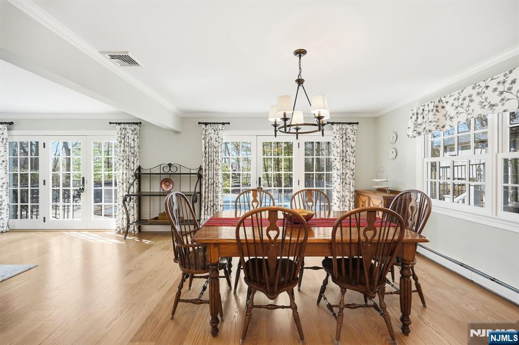 760 Rivenwood Road Franklin Lakes, NJ 07417 - Photo 35 of 48 a view of a dining room with furniture window and wooden floor