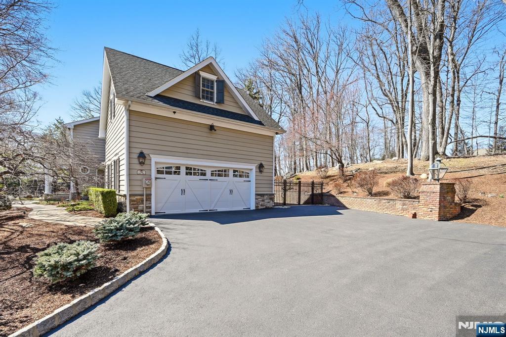 760 Rivenwood Road Franklin Lakes, NJ 07417 - Photo 38 of 48 a view of a house with a yard and large tree
