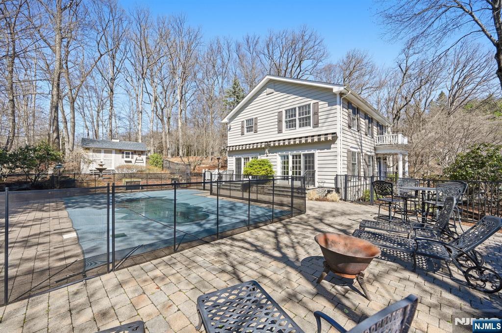 760 Rivenwood Road Franklin Lakes, NJ 07417 - Photo 46 of 48 a view of house with yard and sitting area
