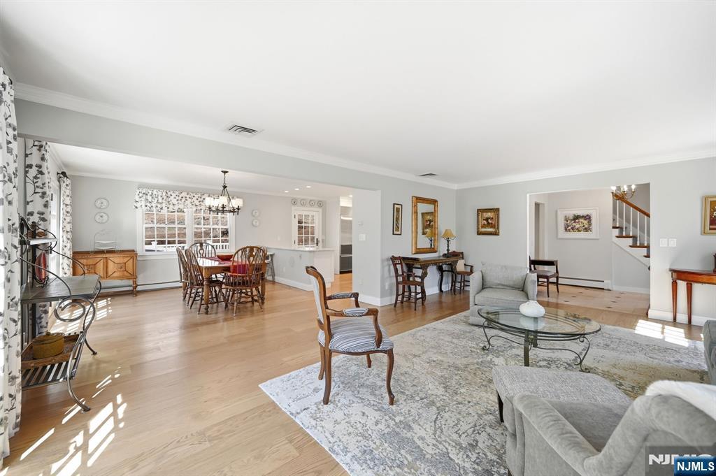 760 Rivenwood Road Franklin Lakes, NJ 07417 - Photo 7 of 48 a living room with furniture and a dining table with chairs