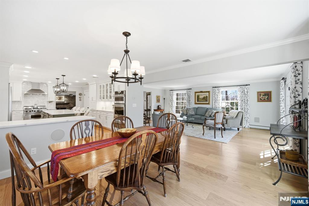 760 Rivenwood Road Franklin Lakes, NJ 07417 - Photo 8 of 48 a view of a dining room with furniture window and wooden floor