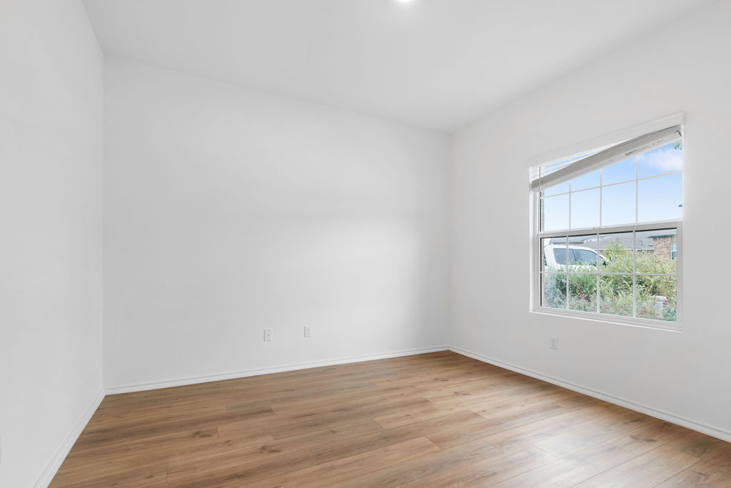 1205 Sweetspire Street Leander, TX 78641 - Photo 12 of 31 Unfurnished room with light wood-type flooring and baseboards