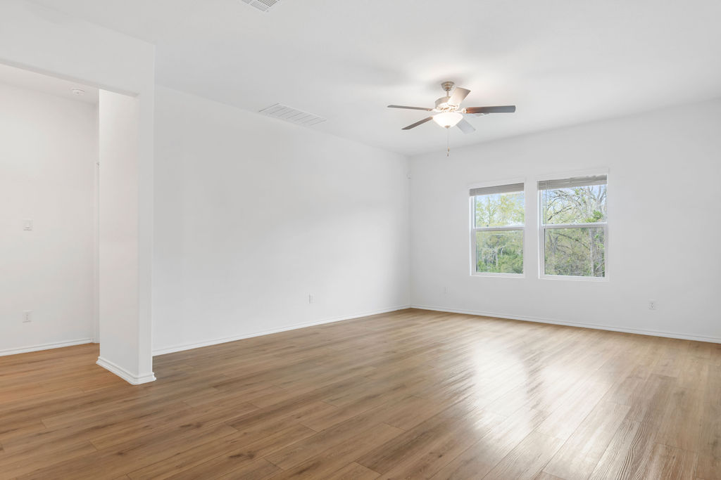 1205 Sweetspire Street Leander, TX 78641 - Photo 13 of 31 Unfurnished room featuring light wood-type flooring and ceiling fan