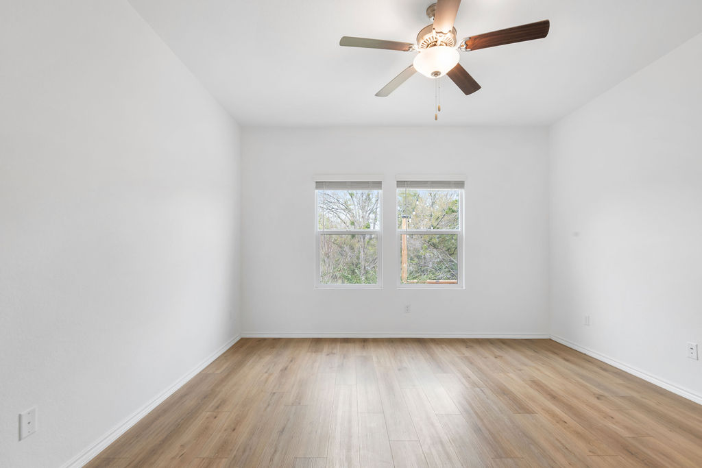 1205 Sweetspire Street Leander, TX 78641 - Photo 18 of 31 Unfurnished room with light wood-type flooring and ceiling fan