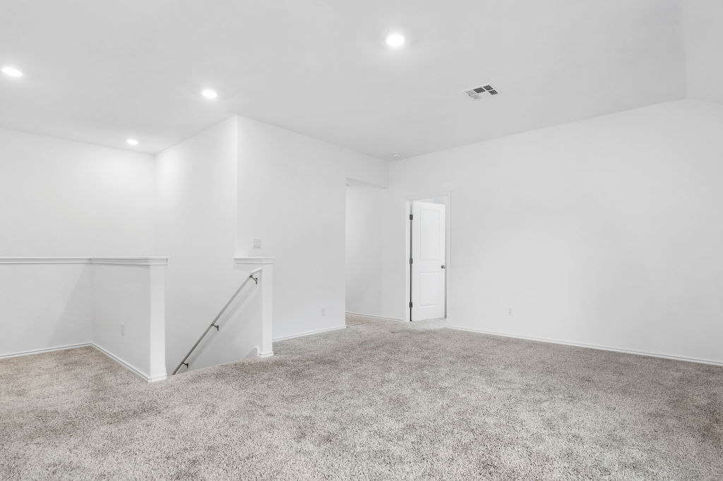 1205 Sweetspire Street Leander, TX 78641 - Photo 22 of 31 Spare room featuring carpet flooring and recessed lighting