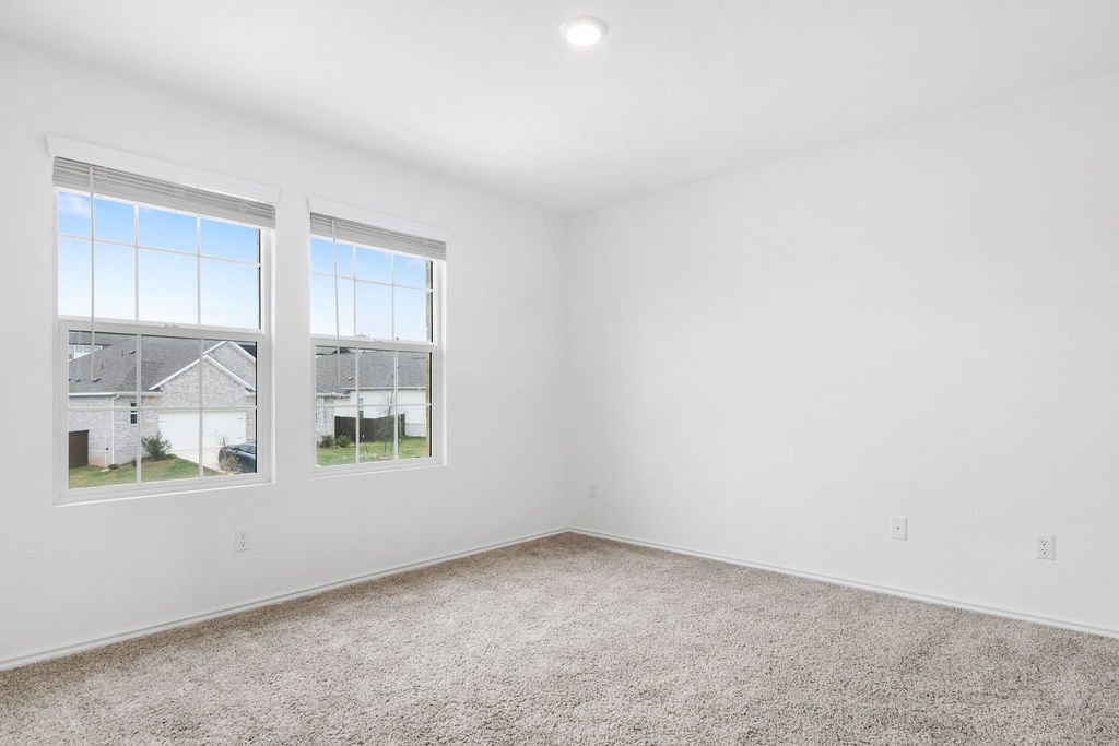 1205 Sweetspire Street Leander, TX 78641 - Photo 23 of 31 Carpeted spare room featuring baseboards