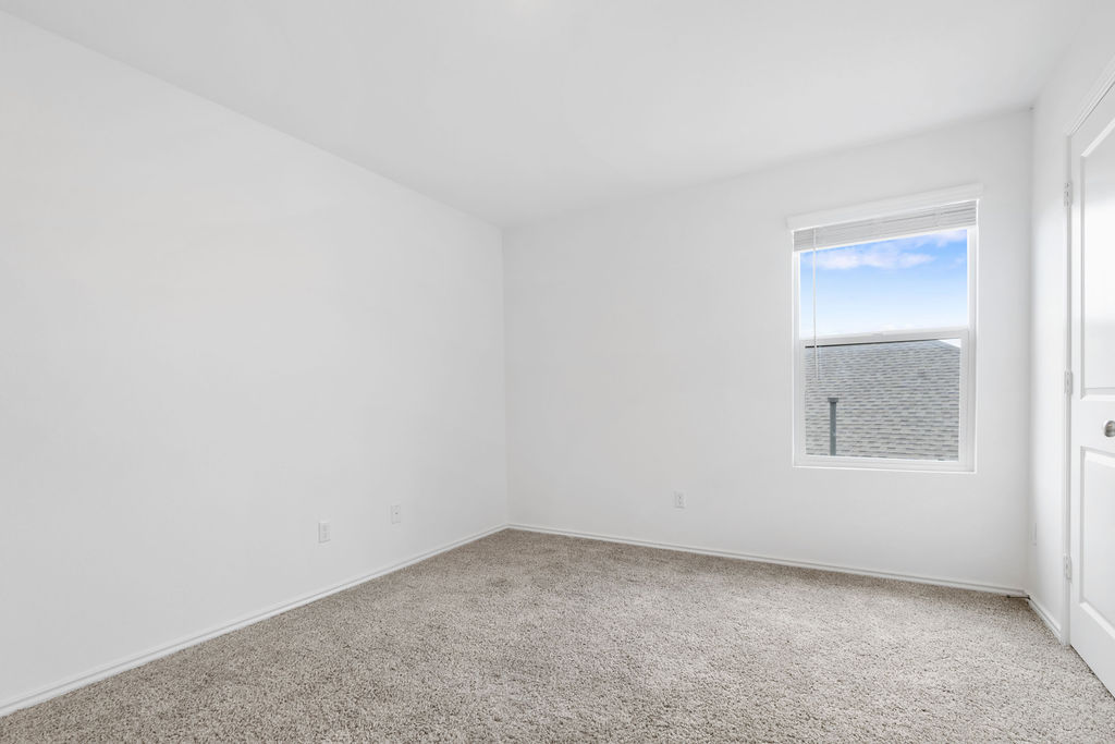 1205 Sweetspire Street Leander, TX 78641 - Photo 25 of 31 Empty room featuring carpet flooring and baseboards