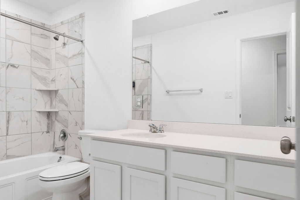 1205 Sweetspire Street Leander, TX 78641 - Photo 26 of 31 Bathroom with tub / shower combination and vanity
