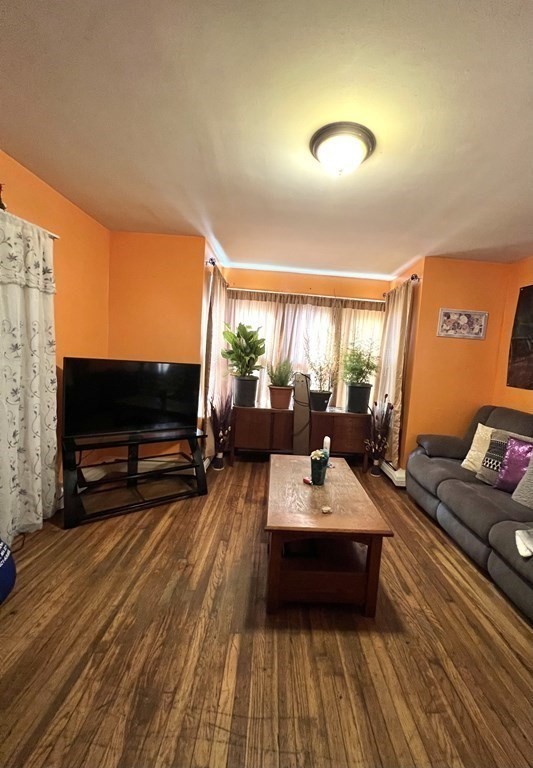 220 Morgan Street Fall River, MA 02721 - Photo 8 of 19 a living room with furniture and a flat screen tv