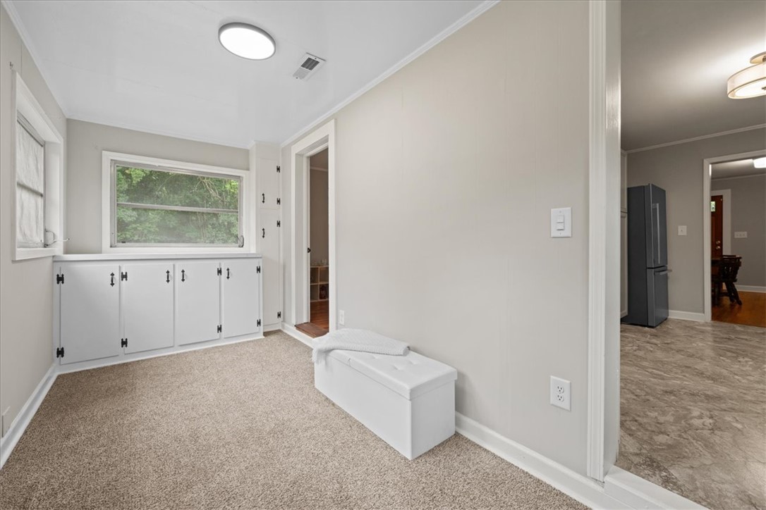 174 Holliday Road Six Mile, SC 29682 - Photo 20 of 49 Comfortable SUN ROOM or FLEX SPACE features built-in storage cabinets and lots of natural light