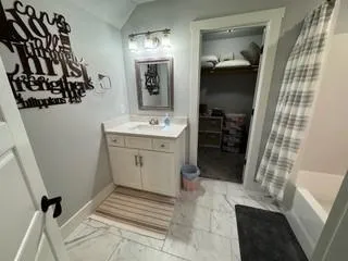 a bathroom with a sink and mirror
