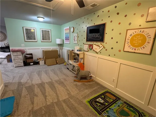 a living room with couch and a flat screen tv