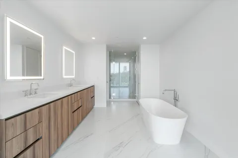a bathroom with a bathtub and shower