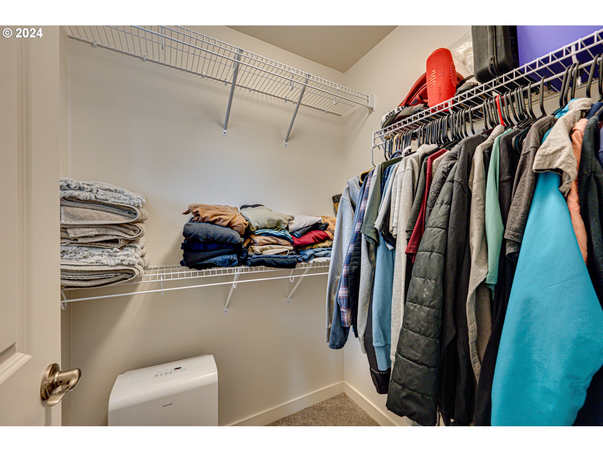 7252 South 13th Street Ridgefield, WA 98642 - Photo 17 of 29 a view of walk in closet with clothes and shoes