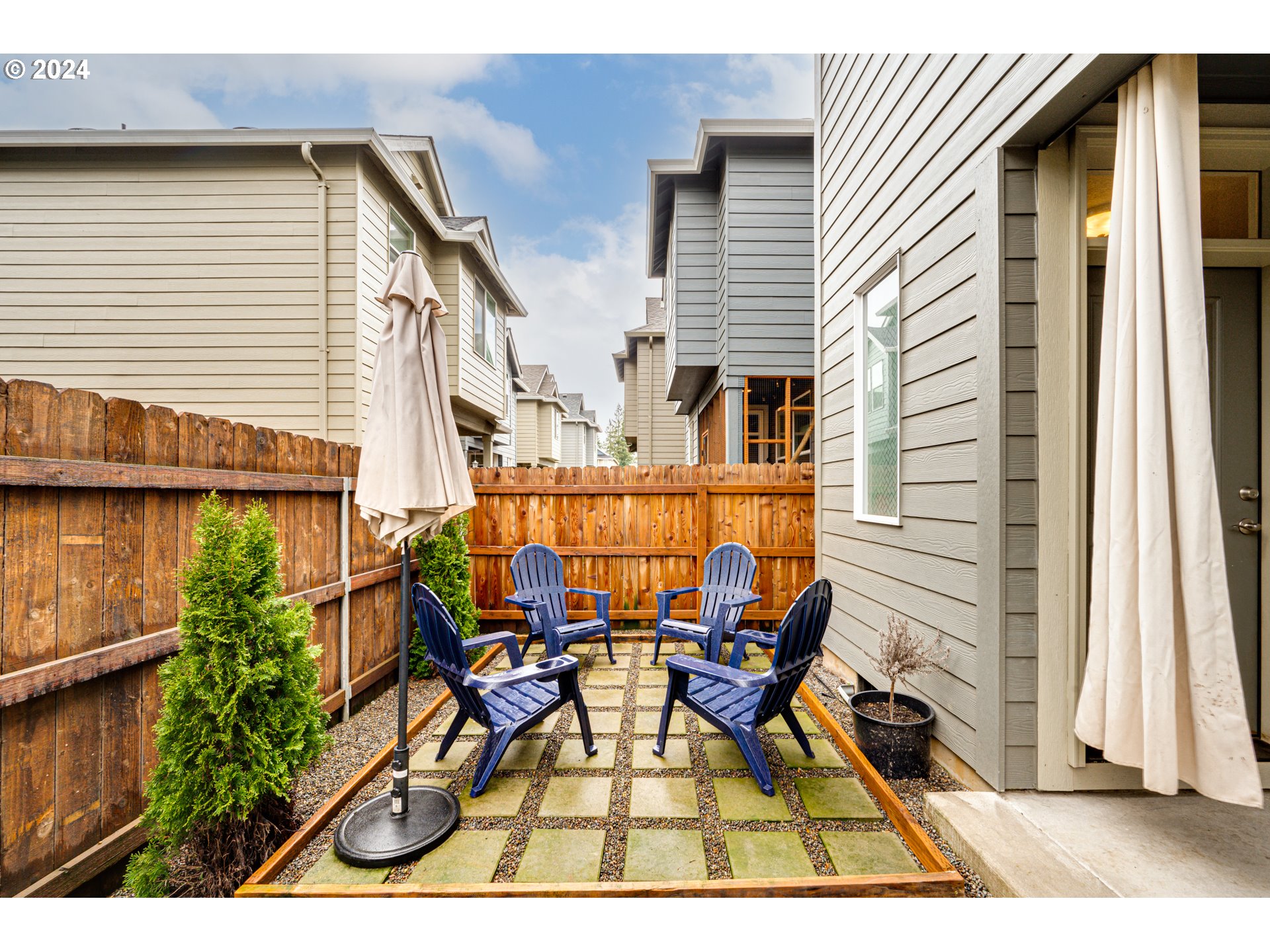 7252 South 13th Street Ridgefield, WA 98642 - Photo 26 of 29 a view of a patio with table and chairs and potted plants