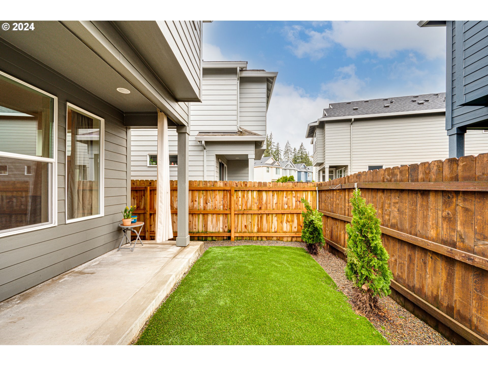 7252 South 13th Street Ridgefield, WA 98642 - Photo 27 of 29 a view of a house with wooden floor and a yard