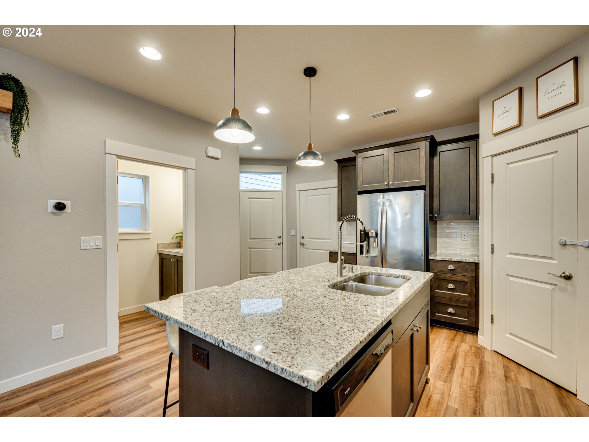 7252 South 13th Street Ridgefield, WA 98642 - Photo 4 of 29 a kitchen with kitchen island a sink stove and refrigerator