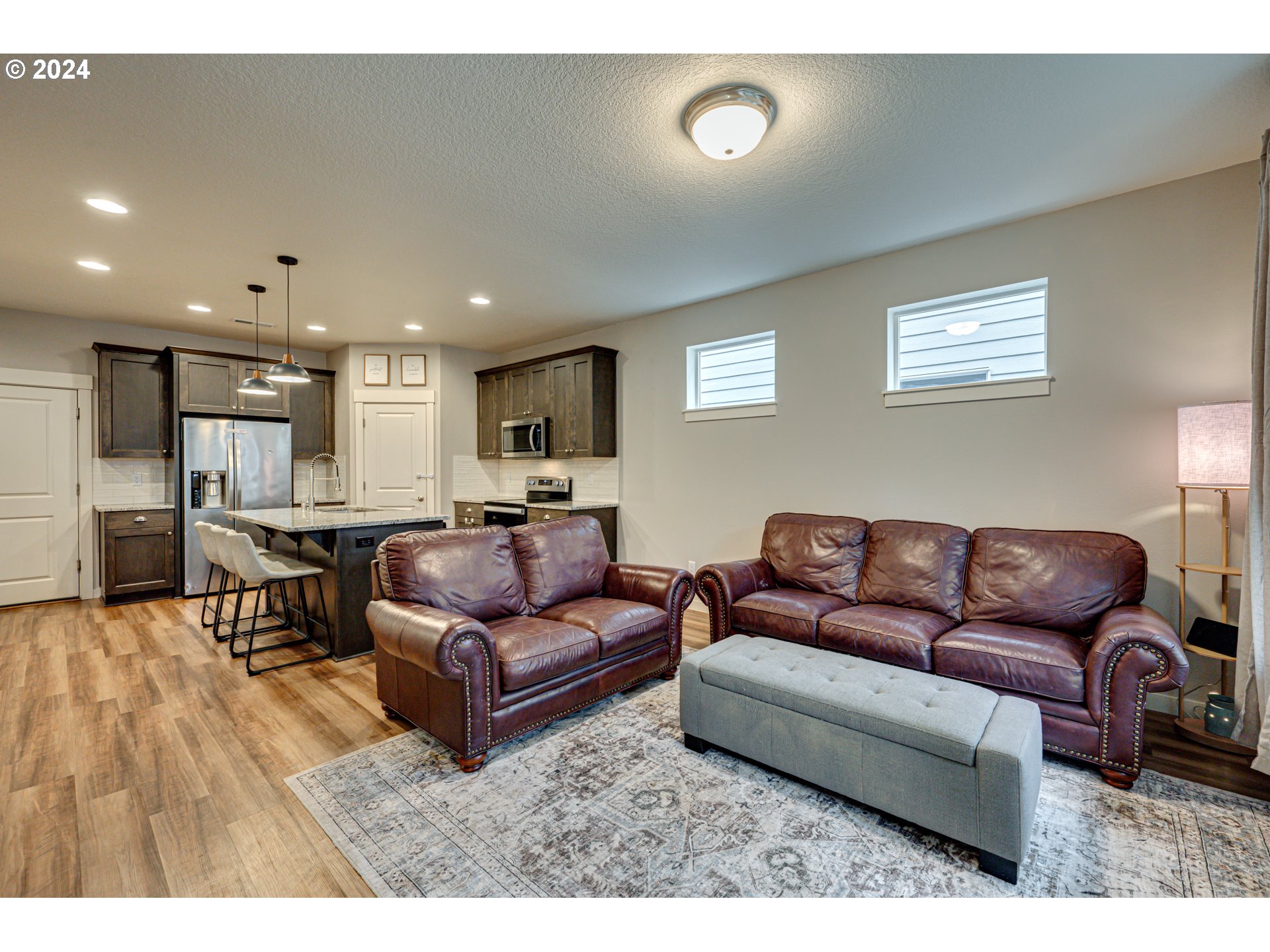 7252 South 13th Street Ridgefield, WA 98642 - Photo 9 of 29 a living room with furniture and a wooden floor