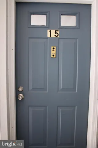 a view of entryway with a front door