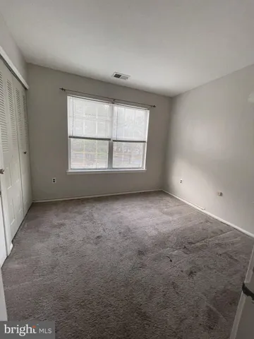 a bathroom with a sink vanity and mirror