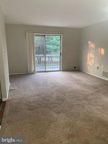 a view of a room with a fan