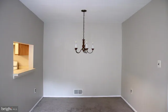 a view of a livingroom with a hallway