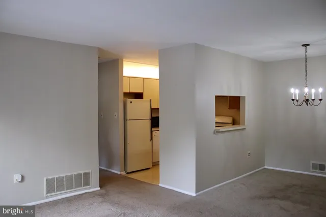 a kitchen with a refrigerator a stove a microwave and cabinets