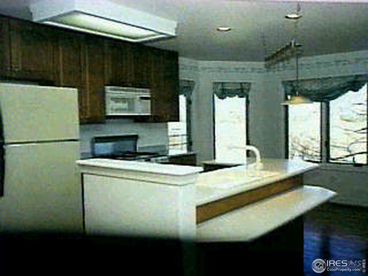 7641 Monarch Road Niwot, CO 80503 - Photo 7 of 8 a kitchen with kitchen island a stove a sink and a refrigerator